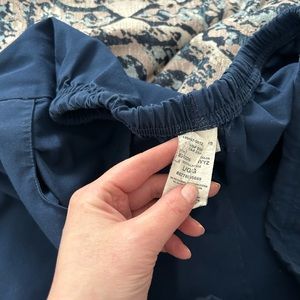 Navy blue drawstring Dickies scrub pants with cargo pocket on right side